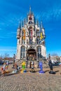 Gouda, Netherlands - 14.4.2022: Gouda main square and town hall. Blue sky, spring weather