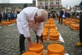 Gouda - Netherlands -2022 - start of the touristic cheese market with children and old farmers and cheesemakers to demontrate