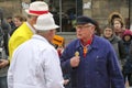 Gouda - Netherlands -2022 - start of the touristic cheese market with children and old farmers and cheesemakers to demontrate