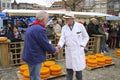 Gouda - Netherlands -2022 - start of the touristic cheese market with children and old farmers and cheesemakers to demontrate