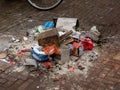 Gouda, South Holland/The Netherlands - January 1 2020: big stack of trash and firework remains in between some old buildings in