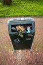 Gouda, South Holland/the Netherlands - March 1 2020: A full waste bin stuffed with normal houshould waste as local citizens do not