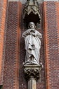 Gouda, South-Holland/The Netherlands - October 27 2018: Close up of the religius Maria statue in the front facade of the Gouwekerk Royalty Free Stock Photo