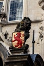 Gouda, South-Holland/The Netherlands - October 27 2018: Lion statue holding a shield with another lion as found at the front of