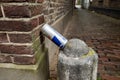 Gouda, South Holland/The Netherlands - September 28 2020: Empty Red Bull drink can left behind on a small stone or cement pilon in