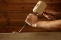 Gouge wood chisel carpenter tool hammer hand Royalty Free Stock Photo