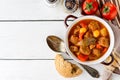 Goulash in ceramic bowl on white wooden background. Traditional hungarian soup. Royalty Free Stock Photo