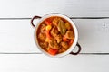 Goulash in ceramic bowl on white wooden background. Traditional hungarian soup. Royalty Free Stock Photo