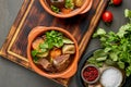 Goulash with large pieces of beef and vegetables. Burgundy meat. Dark backdrop Royalty Free Stock Photo