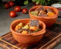 Goulash with large pieces of beef and vegetables. Burgundy meat. Slow stewing Royalty Free Stock Photo