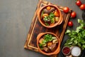 Goulash with large pieces of beef and vegetables. Dark brown backdrop. top view, copy space Royalty Free Stock Photo
