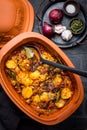 Goulash with potatoes and sauerkraut. Beef and vegetable stew in clay pot Royalty Free Stock Photo