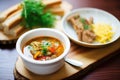 goulash soup with a crispy garlic baguette slice on the side