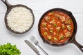 Goulash traditional Hungarian beef meat stew soup food dinner cooked recipe with spicy gravy sauce in cast iron pan Royalty Free Stock Photo