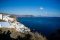 Gourgeous view from white walled resort in Santorini, Greece, with ocean, cliffs and caldera of Santorini in the Royalty Free Stock Photo