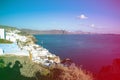 Gourgeous view from white walled resort in Santorini, Greece, with ocean, cliffs and caldera of Santorini in the