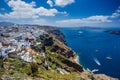 Gourgeous view from white walled town of Fira in Santorini, Greece, with ocean, cliffs and caldera of Santorini in the Royalty Free Stock Photo