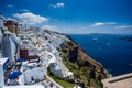 Gourgeous view from white walled town of Fira in Santorini, Greece, with ocean, cliffs and caldera of Santorini in the Royalty Free Stock Photo