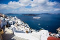 Gourgeous view from white walled town of Fira in Santorini, Greece, with ocean, cliffs and caldera of Santorini in the
