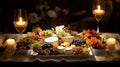 Gourmet Appetizer Platter Still Life - A still life of a glass of wine surrounded by fresh fruit, flowers, and candles