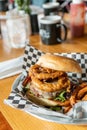 Gourmet BBQ Onion Ring Hamburger With Fries Royalty Free Stock Photo