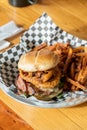 Gourmet BBQ Onion Ring Hamburger With Fries Royalty Free Stock Photo