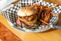 Gourmet BBQ Onion Ring Hamburger With Fries Royalty Free Stock Photo