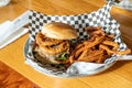 Gourmet BBQ Onion Ring Hamburger With Fries Royalty Free Stock Photo