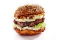 Gourmet beef burger with cheese and fresh walnuts