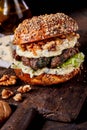 Gourmet beef burger with walnuts and cheese