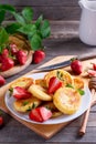 Gourmet Breakfast - Cottage cheese pancakes, syrniki, curd fritters with strawberry and mint