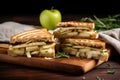 gourmet brie and apple panini sliced diagonally