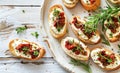 Gourmet Bruschetta With Roasted Tomatoes and Fresh Basil on a White Plate Royalty Free Stock Photo