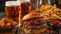 Gourmet burger with craft lager and seasoned fries on a rustic table Royalty Free Stock Photo