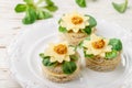 Gourmet canapÃÂ©s of bread with cheese, herbs and sweet mustard. Tasty snack for gourmets in a white plate. Antipasti. Selective Royalty Free Stock Photo