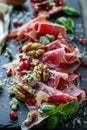 Gourmet charcuterie board with prosciutto, blue cheese, walnuts