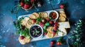 Gourmet cheese and fruit platter with various cheeses, crackers Royalty Free Stock Photo