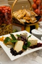 Gourmet cheese plate with garnishes Royalty Free Stock Photo