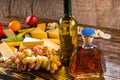 Gourmet cheese platter with alcoholic beverages Royalty Free Stock Photo