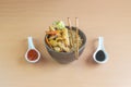 gourmet chinese food with chopsticks. in bowl with fried rice, chicken, vegetables, chun kun,