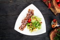 Gourmet cooked beef meat sauce onion ring salad Royalty Free Stock Photo