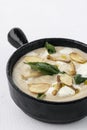 gourmet cream of mushroom soup in black ceramic bowl