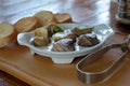 Gourmet, delicious escargo snack with butter, garlic and herbs. French traditional dish of grape snails