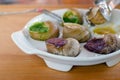 Gourmet, delicious escargo snack with butter, garlic and herbs. French traditional dish of grape snails