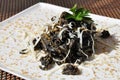 Italian food. Pasta with squid ink and pecorino cheese. Royalty Free Stock Photo