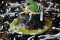 Gourmet design food. Squid artichoke flan