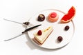 Gourmet desserts on a white plate. Top view