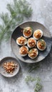 Gourmet deviled eggs with crumbled toppings and dill garnish on rustic plates Royalty Free Stock Photo