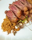 Gourmet dish of delicate cuts of veal on an exquisite spiced rice Royalty Free Stock Photo