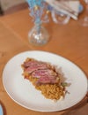 Gourmet dish of delicate cuts of veal on an exquisite spiced rice Royalty Free Stock Photo